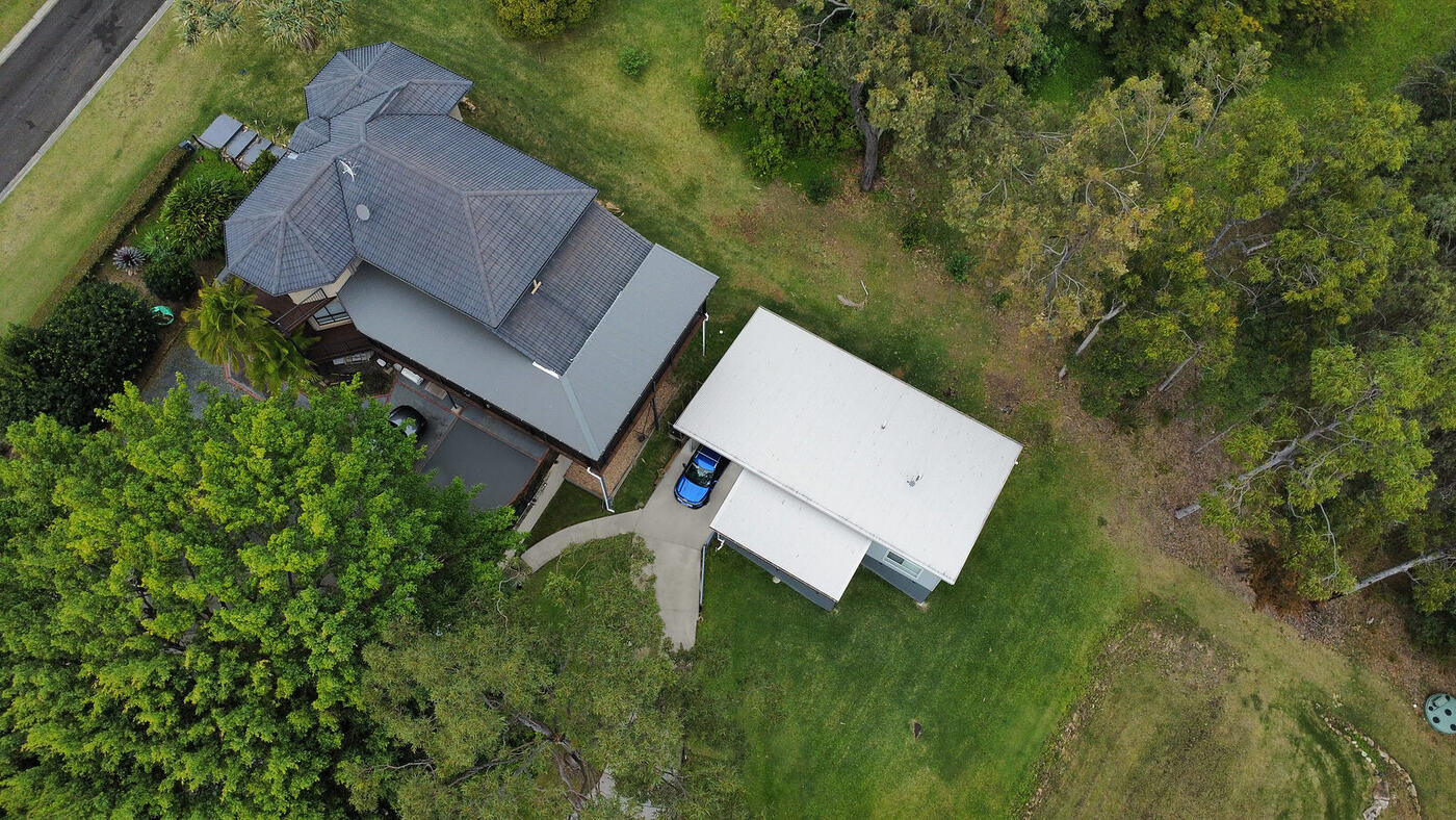 Aerial view of the acreage with the new dwelling beside the main house