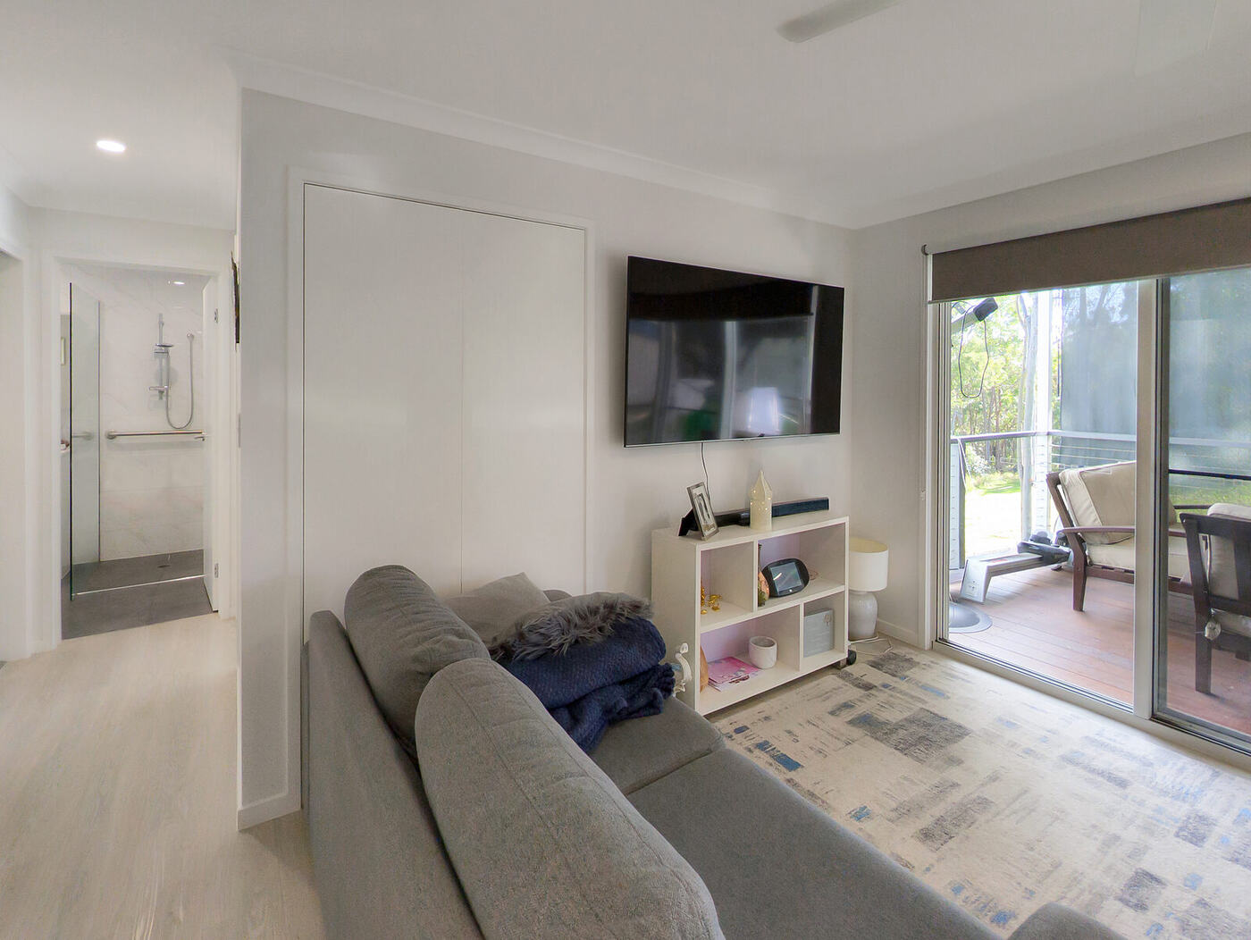 Living area with sliding doors opening onto the deck