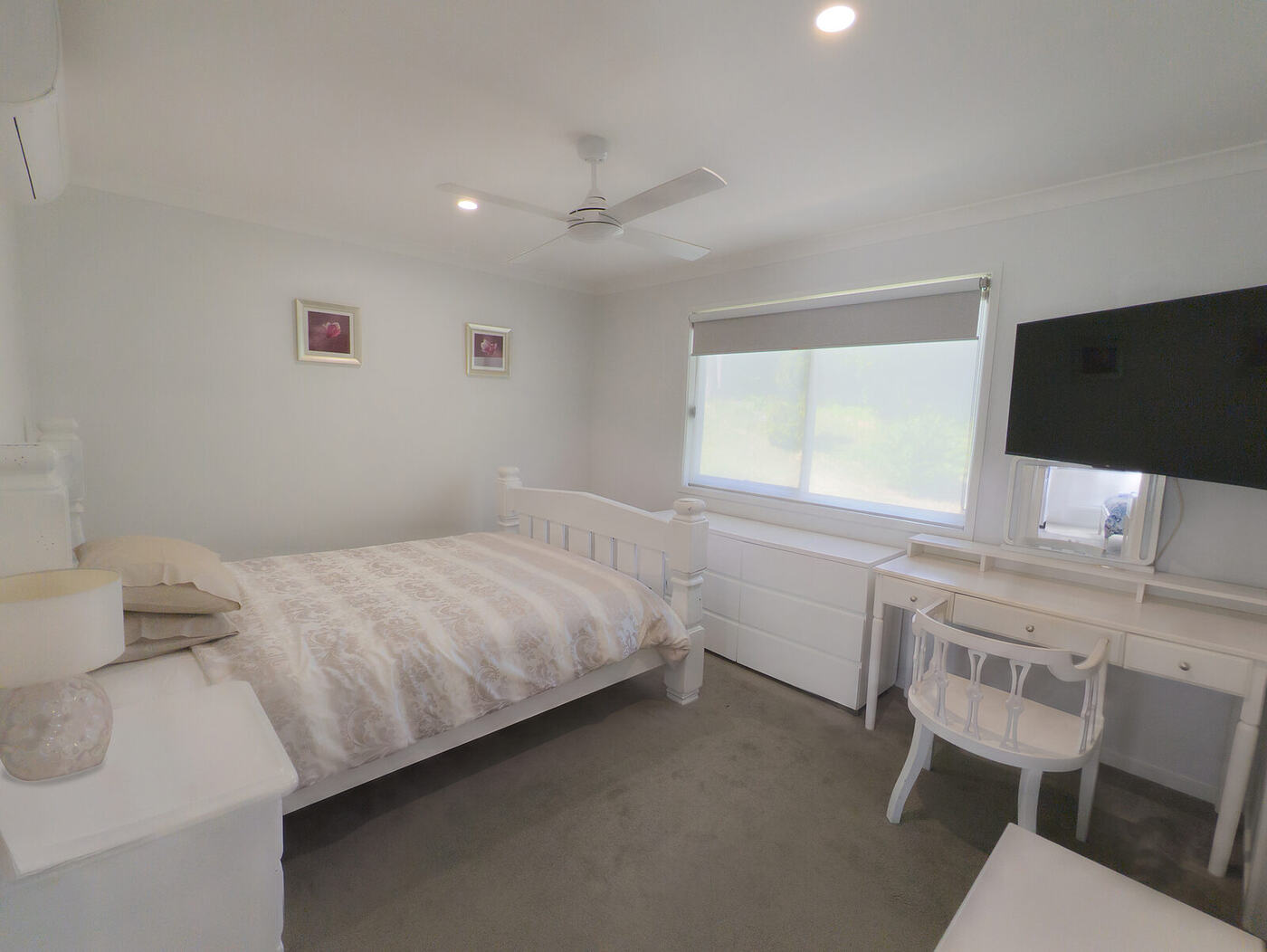 Main bedroom with wide clear space around the bed
