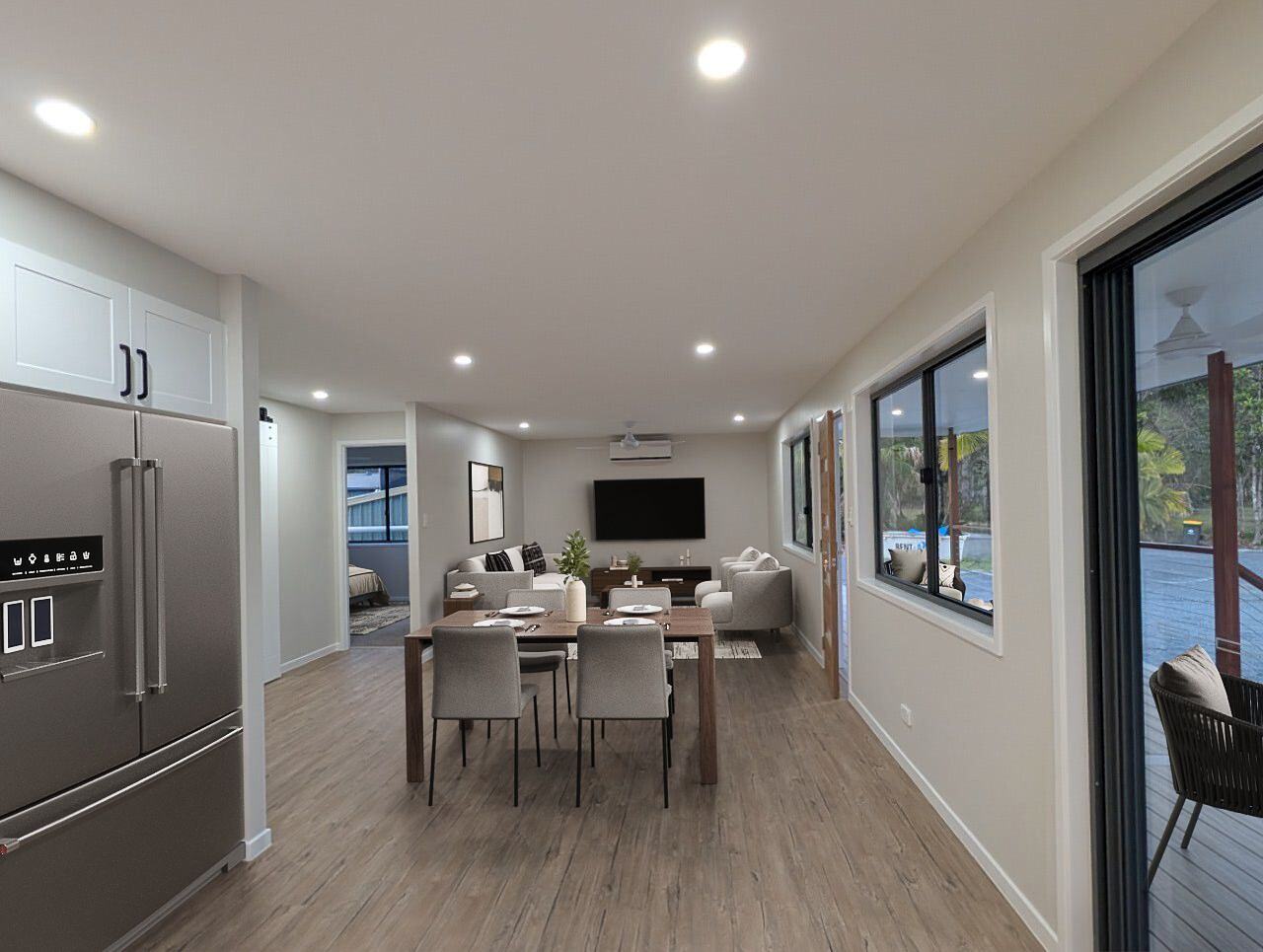 Open-plan kitchen, dining and living looking out to the deck
