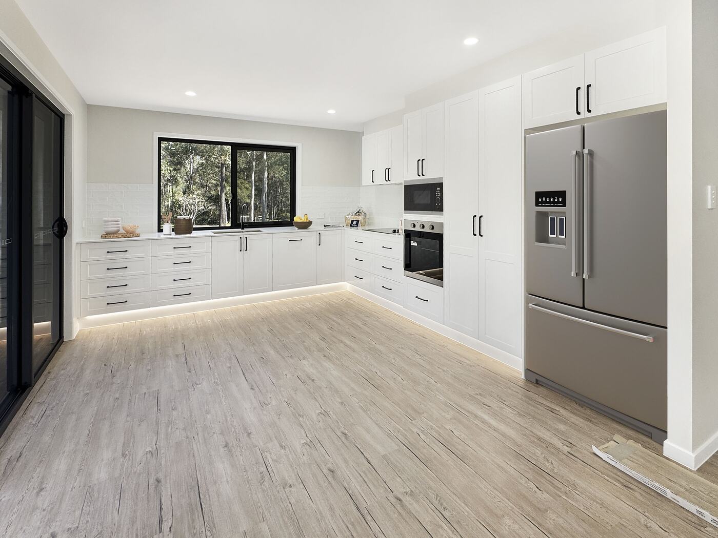 Kitchen with kickboard LED lighting glowing under the cabinetry
