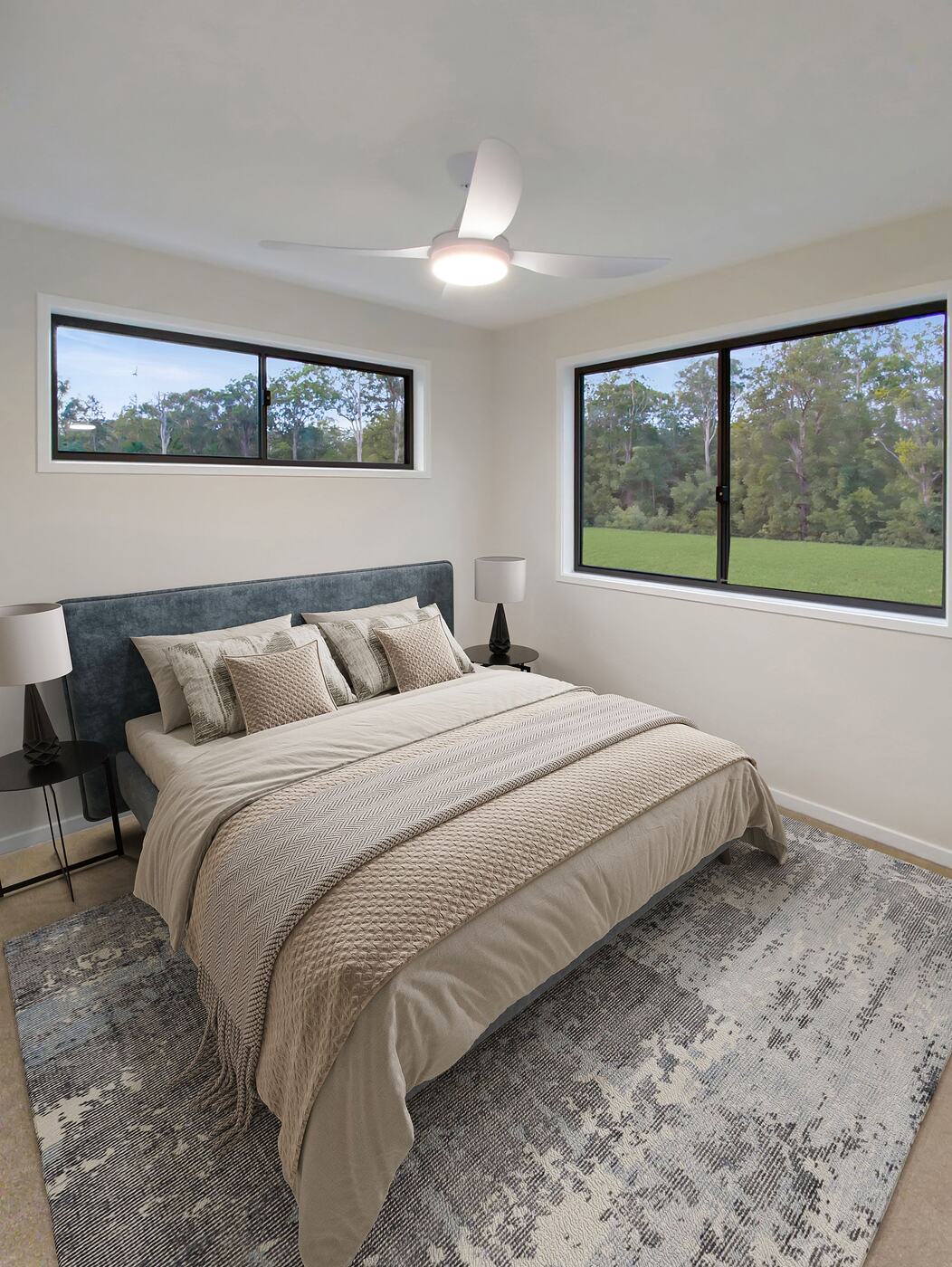 Main bedroom with windows on two walls looking over the paddock